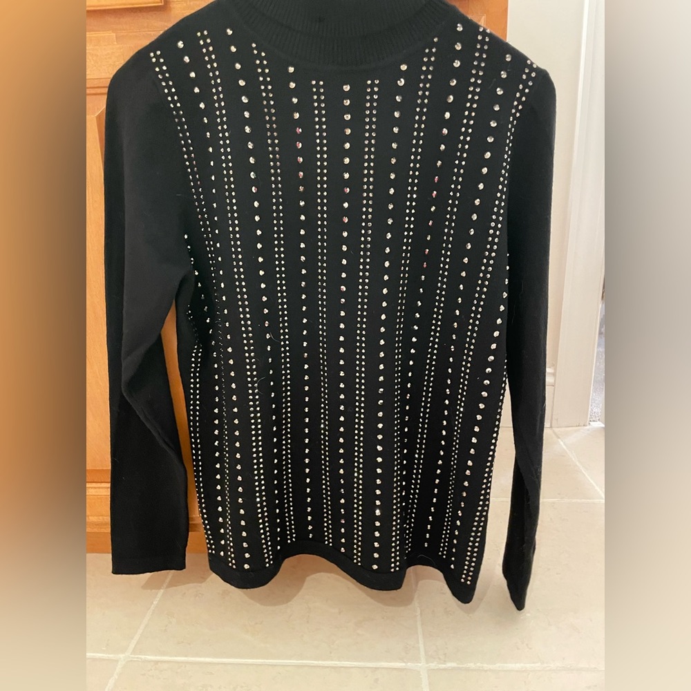 Black studded, turtleneck, cable knit sweater.